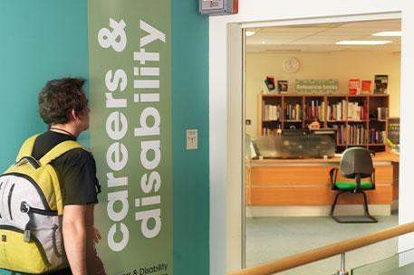 A student walking towards the disability services office.