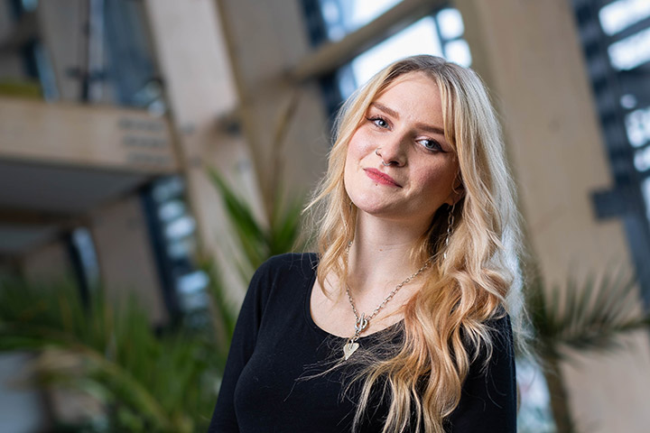 A student smiling at the camera