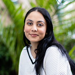 A student smiling at the camera