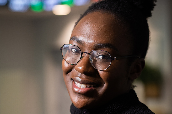 A student smiling at the camera