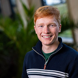 A student smiling at the camera