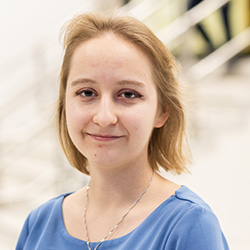 A student smiling at the camera