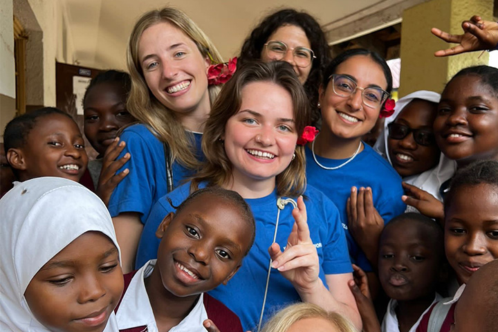 A student smiling at the camera