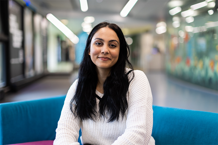 A student smiling at the camera