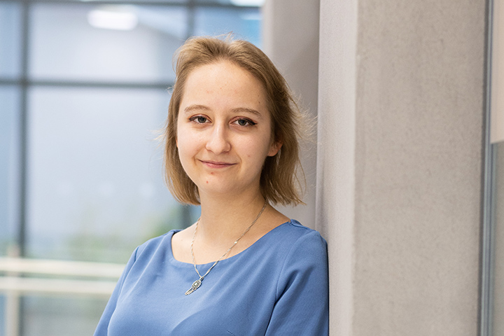 A student smiling at the camera