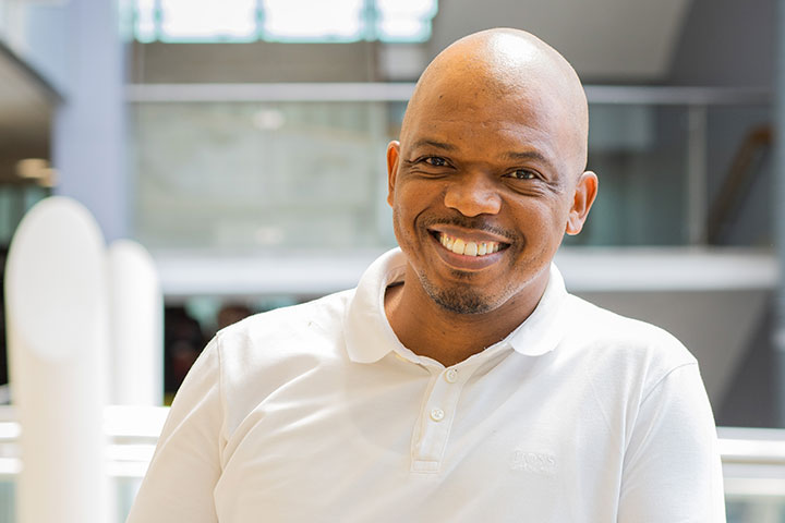 A student smiling at the camera