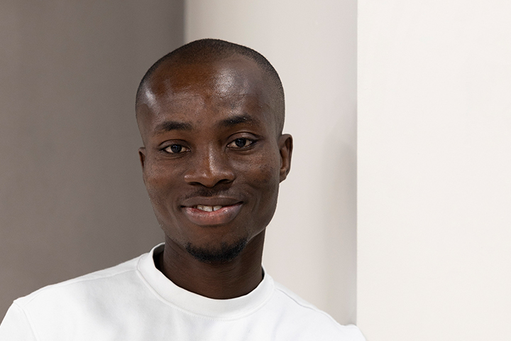 A student smiling at the camera