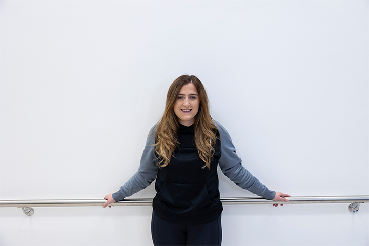 A smiling student posing for a picture