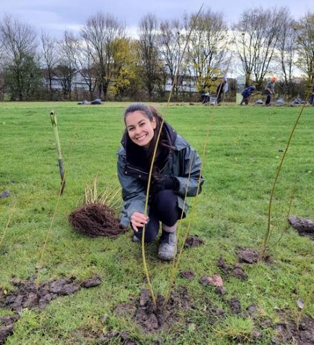 Sustainability society members planting trees in Wayke