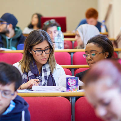 Two students in a lecture