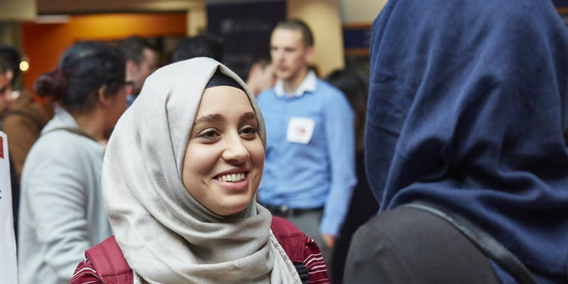 2 students chatting at a careers event