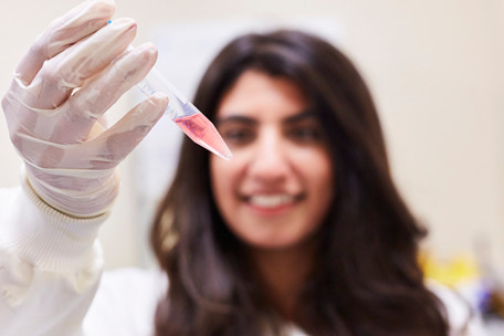 A student with a pipette