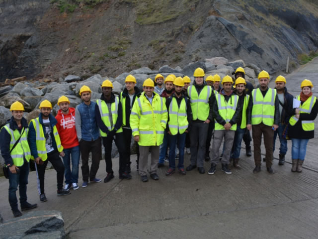 Students wearing high-vis jackets and hard hats in Whitby.