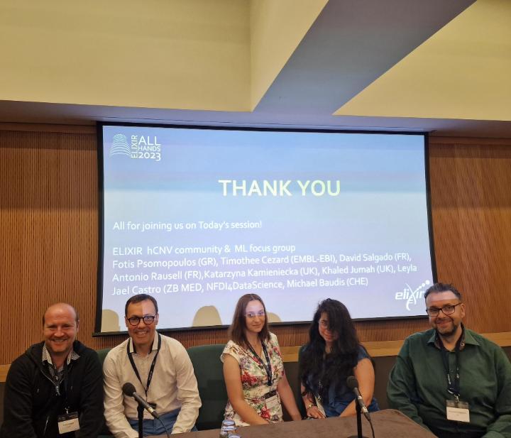 Academics in front of a presentation at the Elixir 2023 meeting