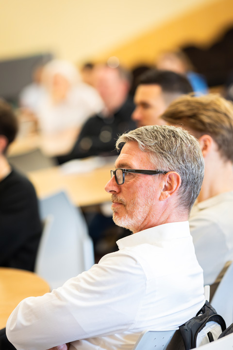 Attendees listening attentively at the MBA Summit 2024