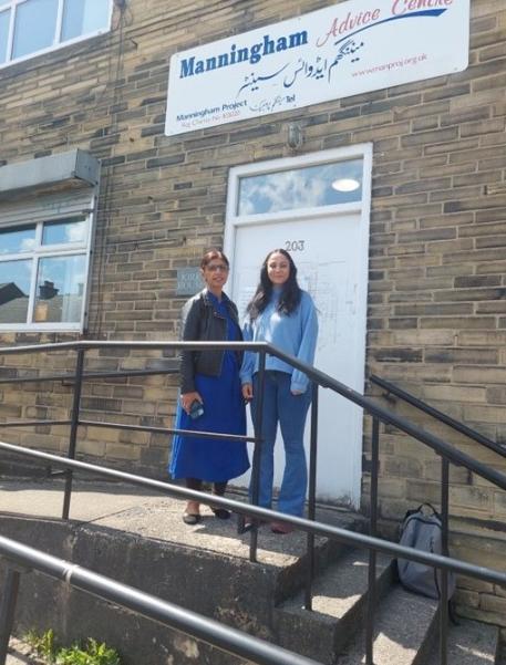 student standing outside building