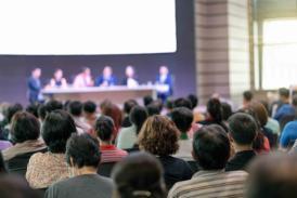 Conference audience with panel on stage