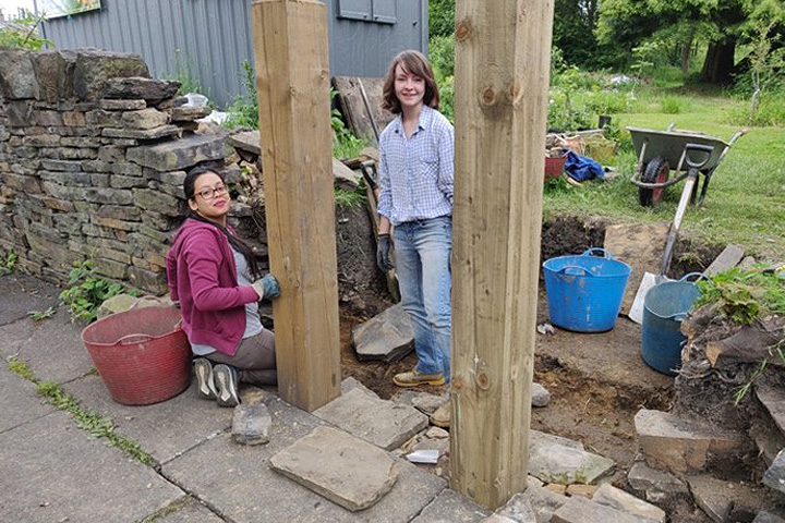 Peace studies students volunteering at the Horton community garden.