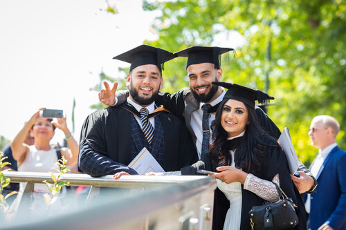 students gathering at summer 2022 graduation