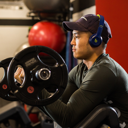 A student lifting weights at the University gym