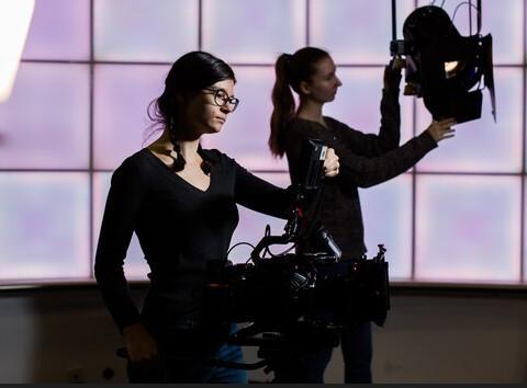 Students filming in a studio