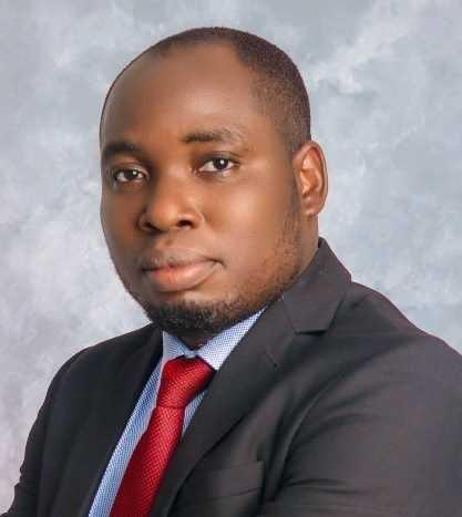 head and shoulders picture of student wearing a suit and tie