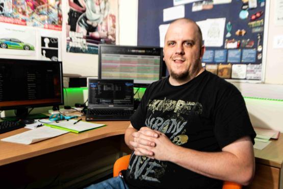 Staff member sat down in front of desk