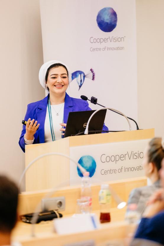 A student standing at a lectern