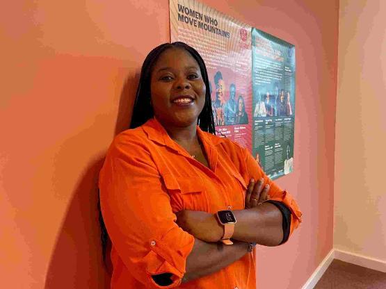 Student stood up in front of Black History Month posters