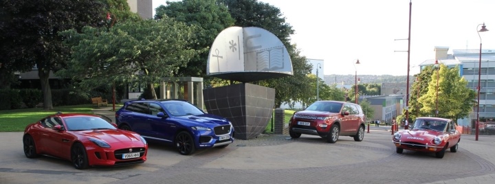 Four cars parked on campus at the University of Bradford, two of them parked on the left side and the other two parked on the right-hand side