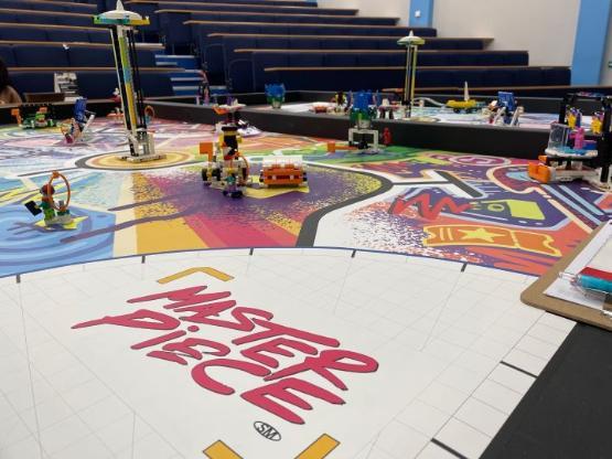 a close-up picture of a table with a number of Lego models on it