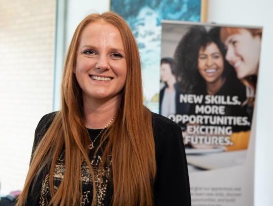 A head and shoulders picture of a person at a university event