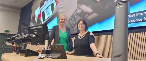 Erica Bellamy and Keren Bielby-Clarke in a lecture theatre