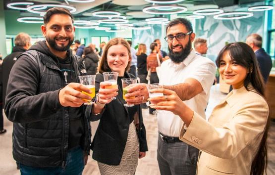 Sabbatical officers holding bubble teas in Student Central