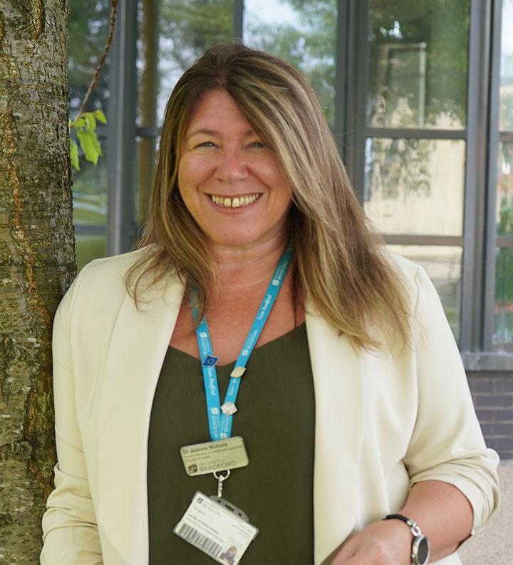 A profile picture of Dr Joanna Nichols outside by a tree