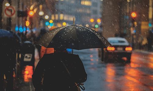 People walking with umbrellas