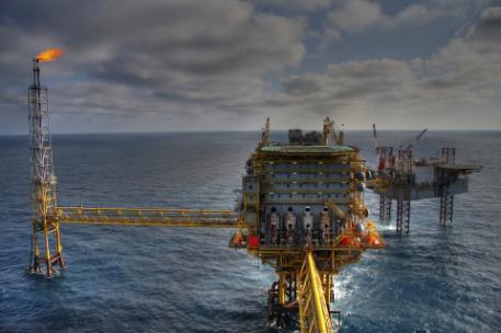 A photograph of an oil rig in the sea