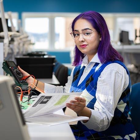 A student looking at the camera.