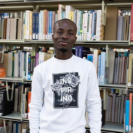 A student smiling at the camera.