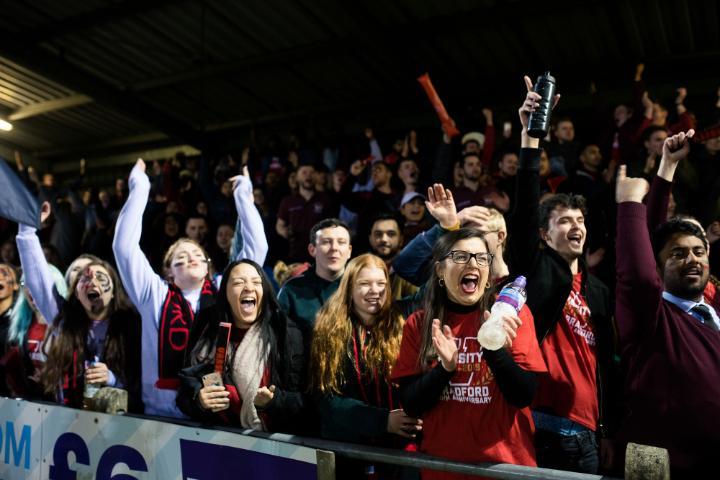 Students cheer at Varsity showing their Team Bradford spirit