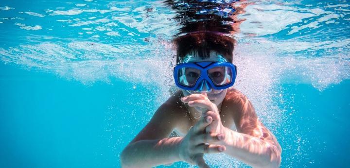 Child swimming under water