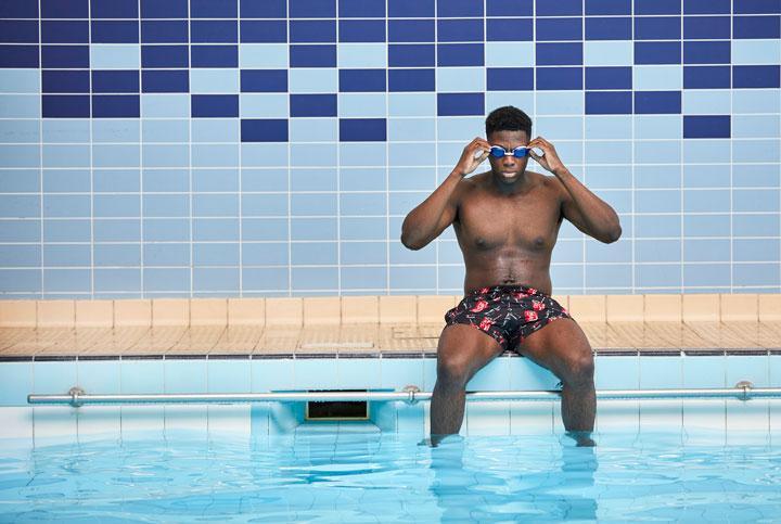 Student Swimmer sat at pool