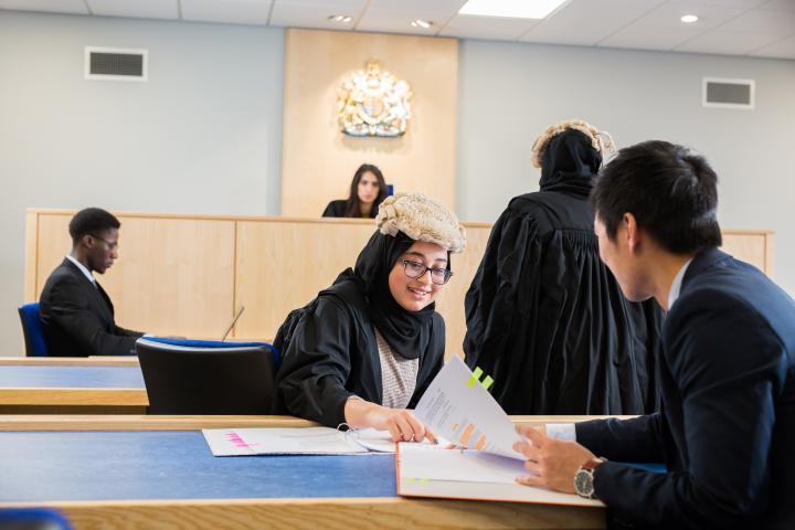 A group of students in the mock courtroom.