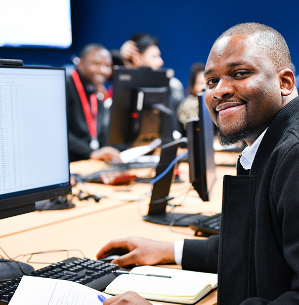 Student working on a desktop computer