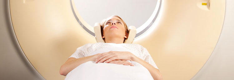 A patient entering an MRI machine