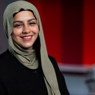 Student smiling at camera