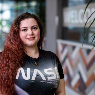 Student looking at camera and smiling