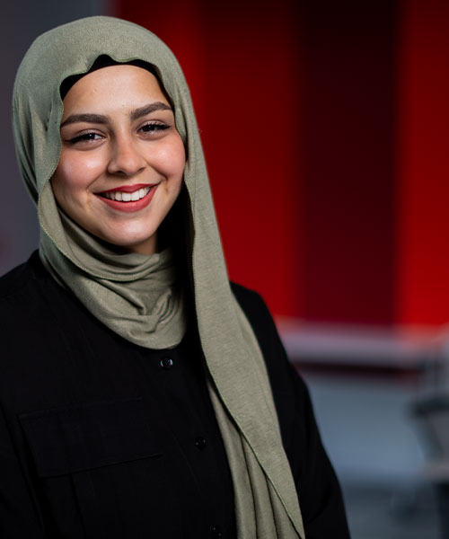 A student smiling at the camera.